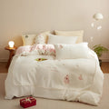 Milk fibre Christmas bedding set with reactive printed tree pattern shown on bed