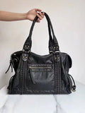 Women's retro motorcycle messenger shoulder bag with woven detail showing organised interior compartments