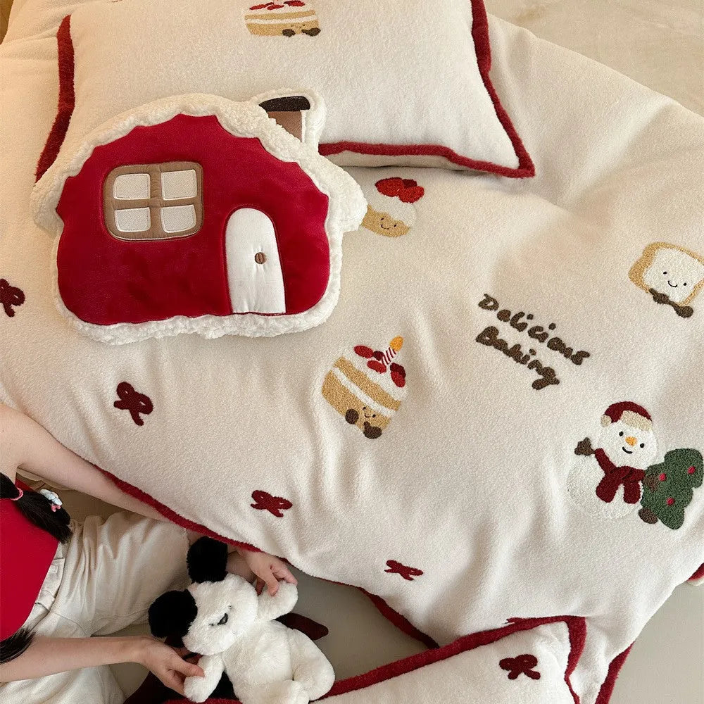 Winter Christmas cartoon print bed linen four-piece set showing fitted sheet, duvet cover, and pillowcases.