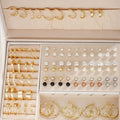 108 geometric pearl earrings with gold electroplated alloy construction and round elements