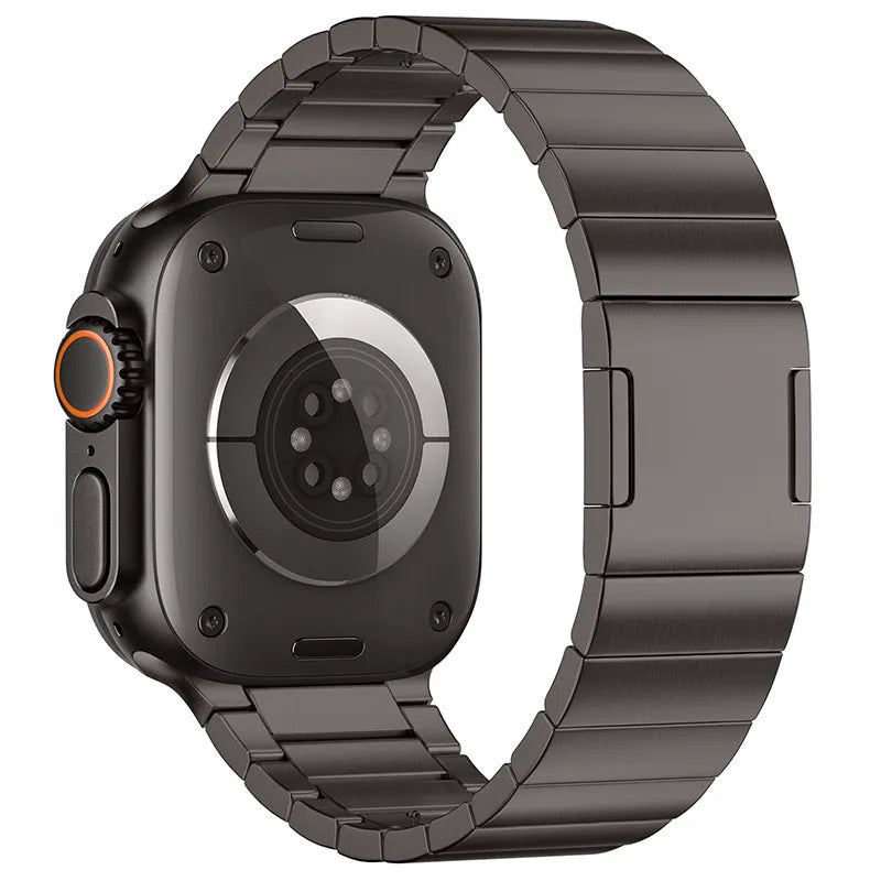 Silver stainless steel magnetic buckle strap for an Apple Watch on a wrist
