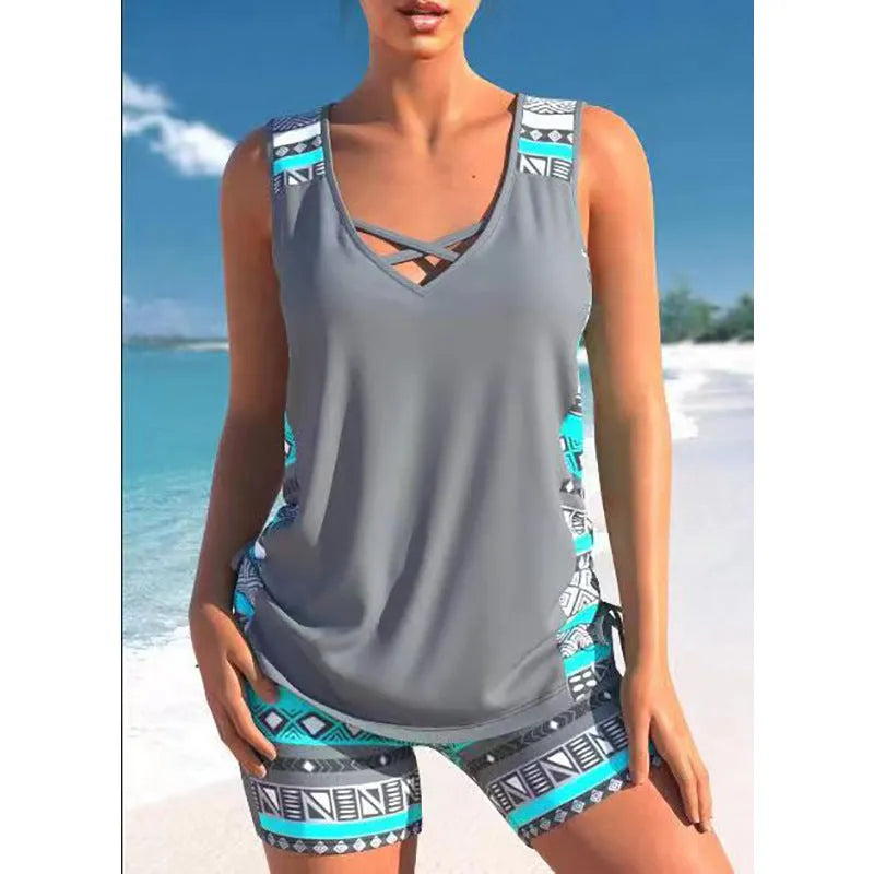Women's floral printed two-piece swimsuit with sleeveless top and matching shorts in blue or green