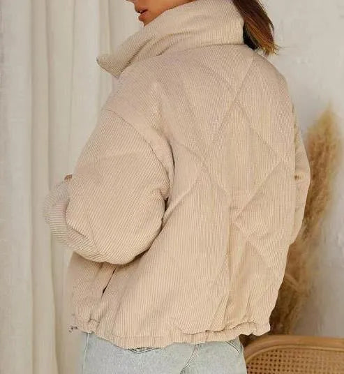 Apricot women's corduroy zip-up jacket with a stand collar, shown on a model.