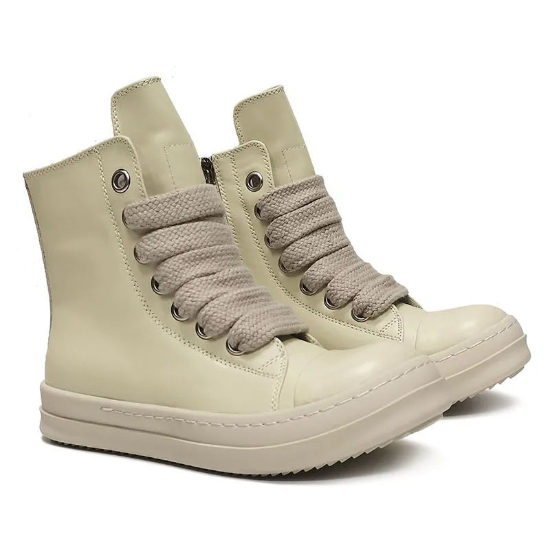Black high-top leather sneakers with side zipper on a white background.