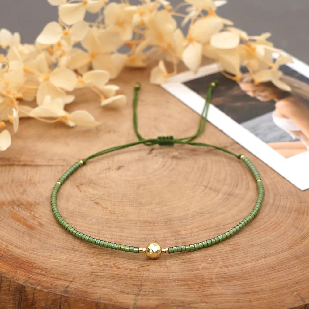 Women's handmade bohemian bracelet with semi-precious stone bead and colourful glass beads.