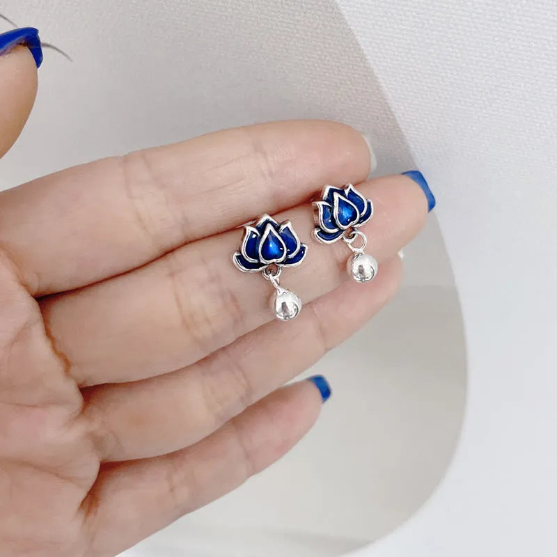 Blue lotus ear studs with lotus seedpod tassel design measuring 1.2cm width