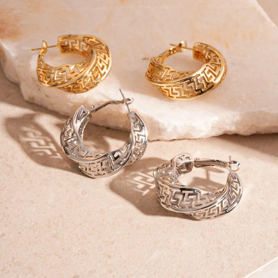 Geometric hollow stud earrings with twisted round design in gold or silver finish