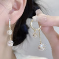 Women's silver drop earrings with confession balloon and rhinestone ball pendants connected by tassel detailing