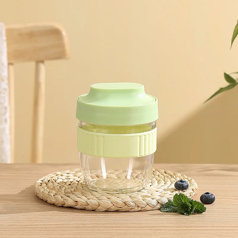 Green plastic salad cup with clear lid and spoon, sealed leak-proof design.