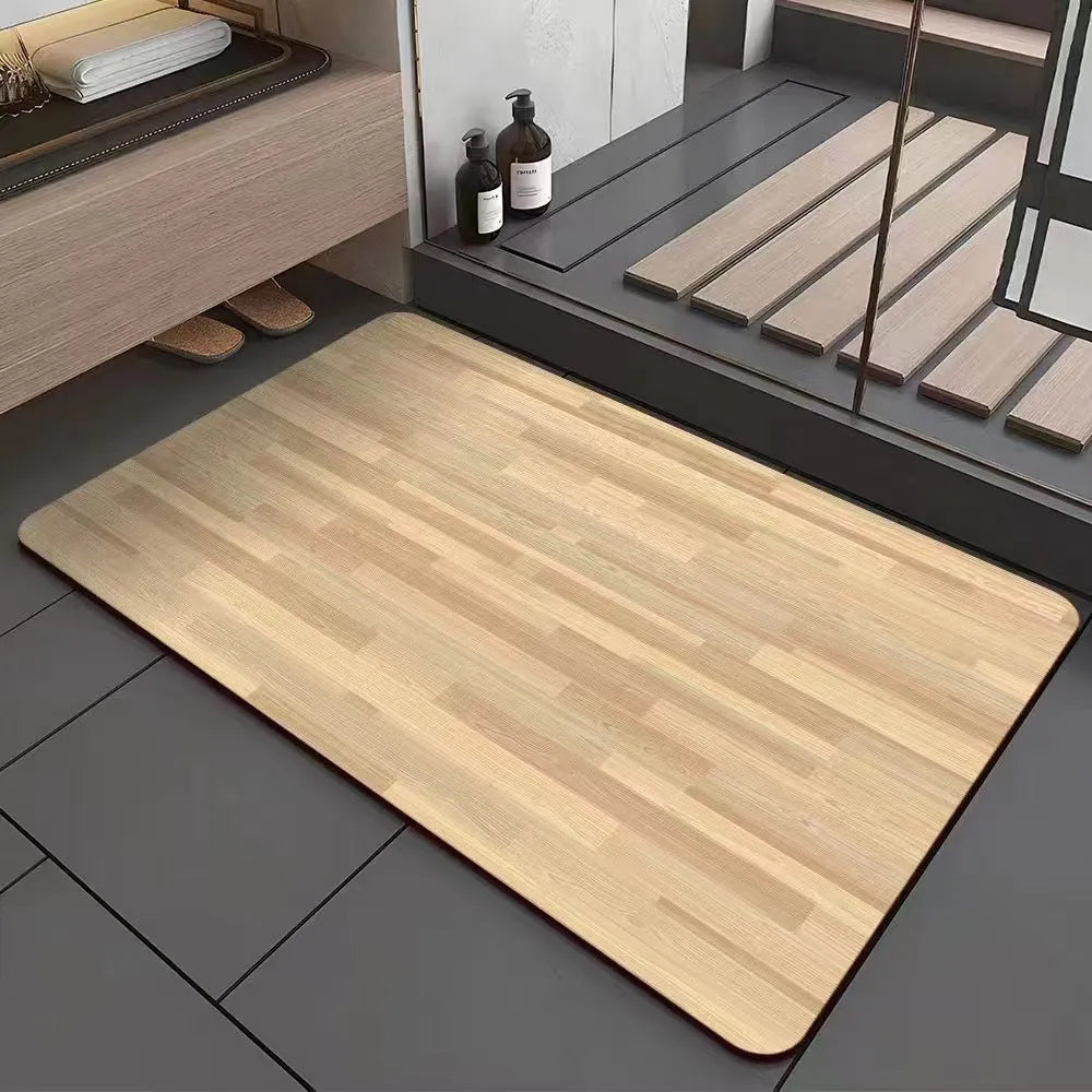 Square diatomite bathroom floor mat with geometric print in a wood grain colour on a tiled floor.
