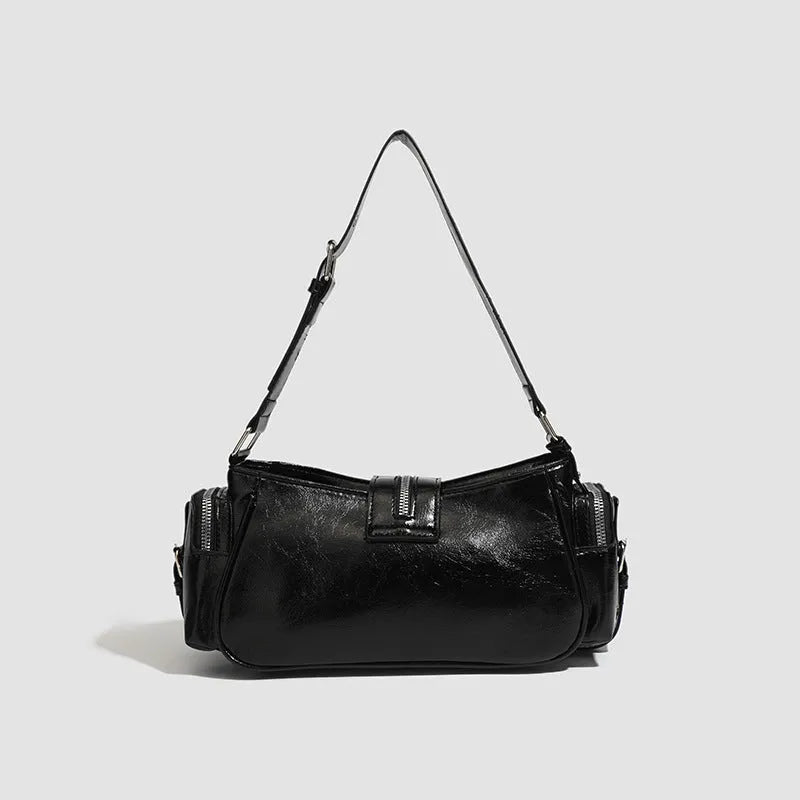 Black retro dumpling-shaped women's shoulder handbag with exterior pockets and organised interior.