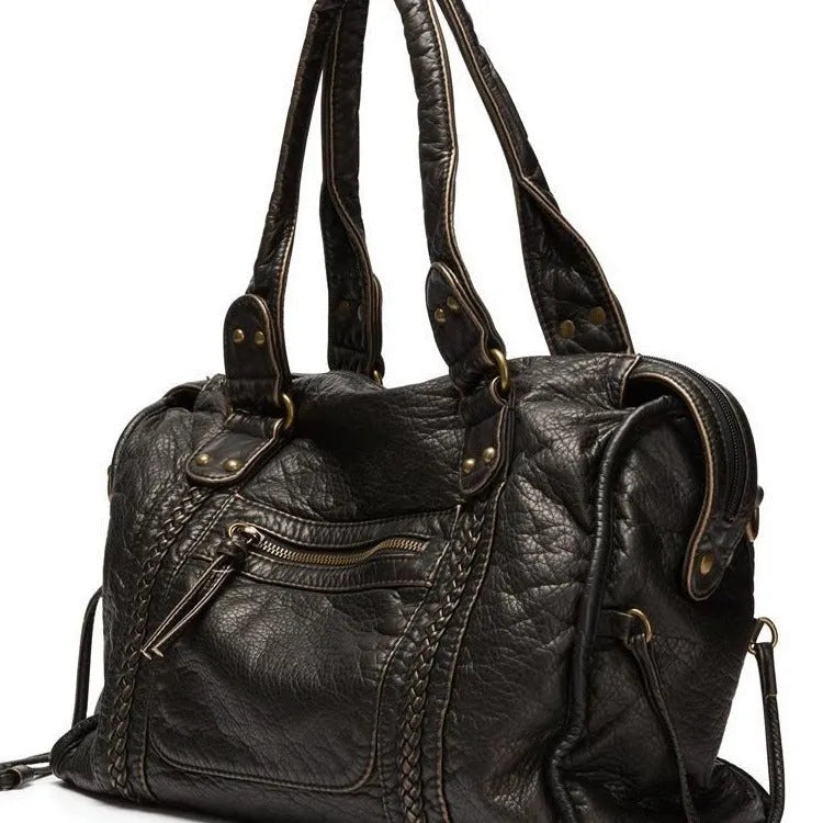 Women's retro motorcycle messenger shoulder bag with woven detail showing organised interior compartments