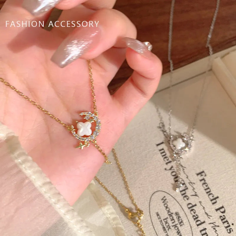 Women's star moon necklace with zirconium accents on adjustable chain in gold or silver finish