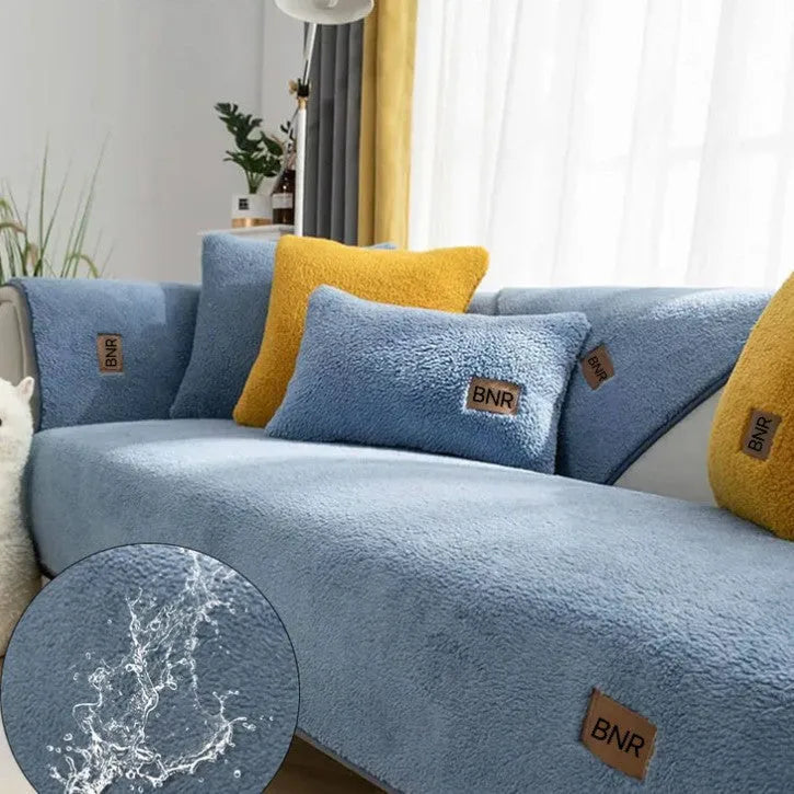 Lambswool sofa cover in solid blue colour on a three-seater sofa