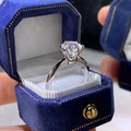 White gold plated women's ring with a geometric zircon stone in a six-claw setting.