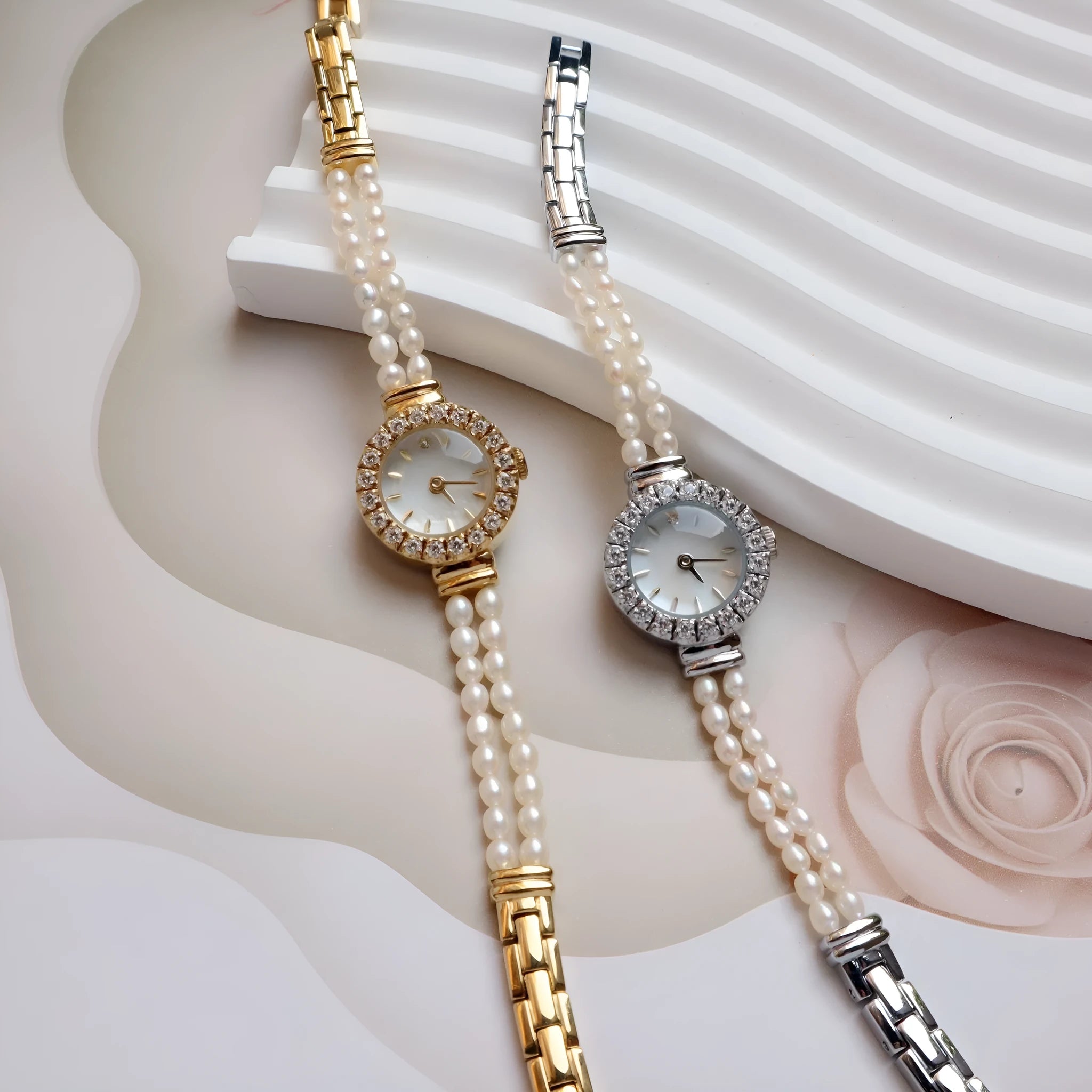 Women's light gold bracelet watch with freshwater pearl accents and round 18mm dial