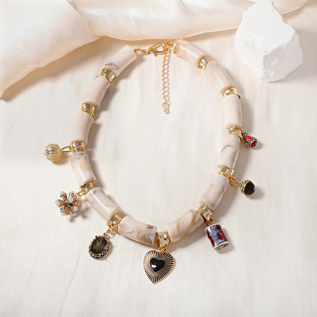 Electroplated heart-shaped resin necklace with bamboo design elements