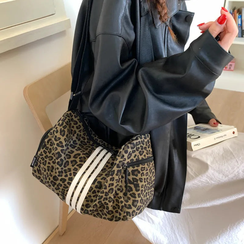 Large capacity leopard print sports messenger bag with cross-body strap and stitching details