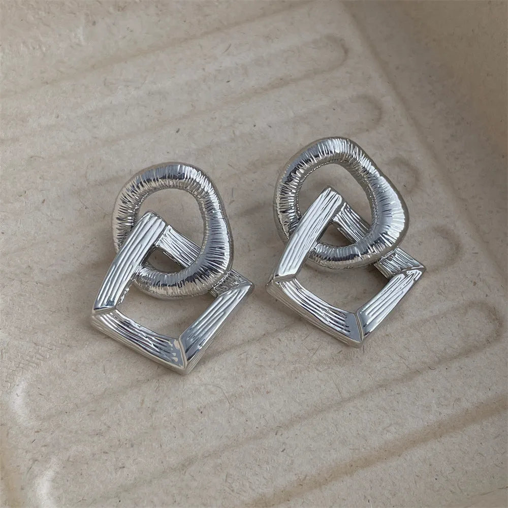 Geometric circle pendant earrings with 3.4cm drop in gold or silver tone electroplated copper