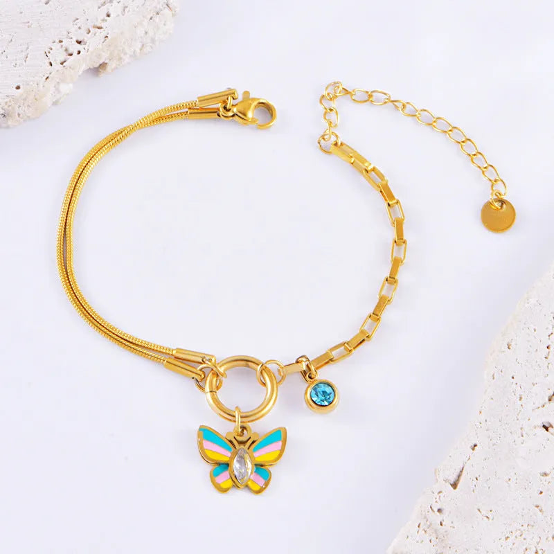 Gold titanium steel butterfly jewellery set with colourful epoxy pendant on snake bones chain necklace and bracelet