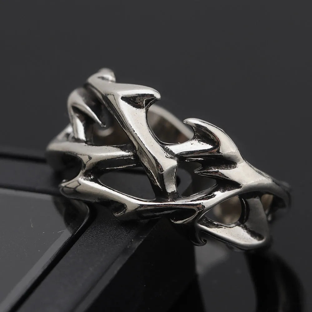 Copper geometric ring with thorn and flower design featuring adjustable opening mechanism