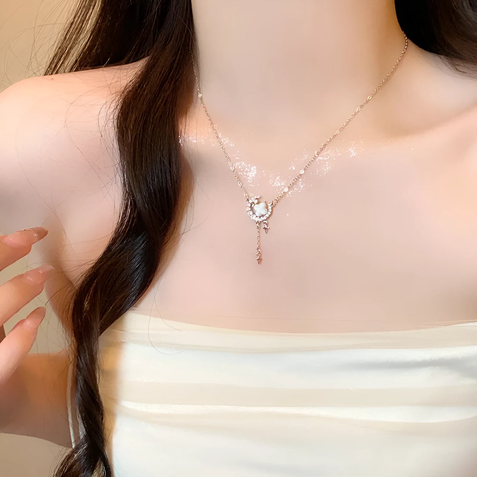 Women's star moon necklace with zirconium accents on adjustable chain in gold or silver finish