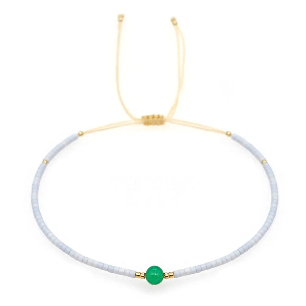 Women's handmade bohemian bracelet with semi-precious stone bead and colourful glass beads.