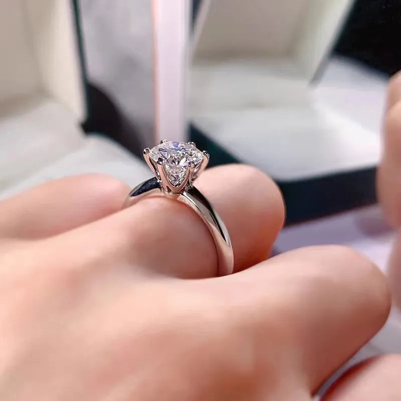 White gold plated women's ring with a geometric zircon stone in a six-claw setting.