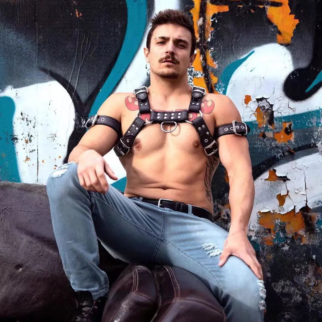 Black leather chest muscle bondage strap with metal buckle and rivets on a mannequin