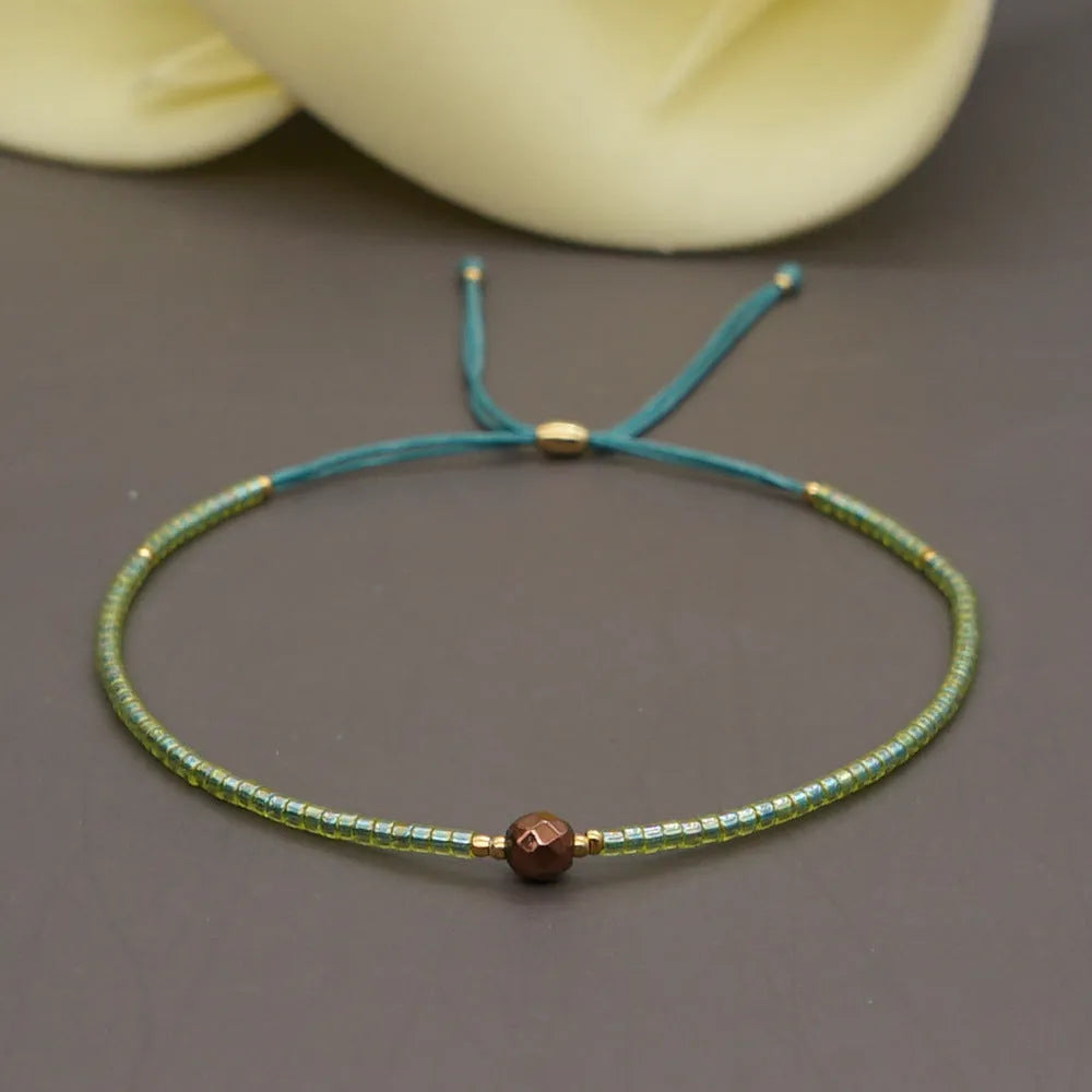 Women's handmade bohemian bracelet with semi-precious stone bead and colourful glass beads.