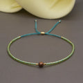 Women's handmade bohemian bracelet with semi-precious stone bead and colourful glass beads.