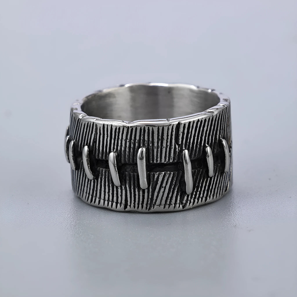 Dark punk geometric U-shaped double ring in titanium steel on a solid background