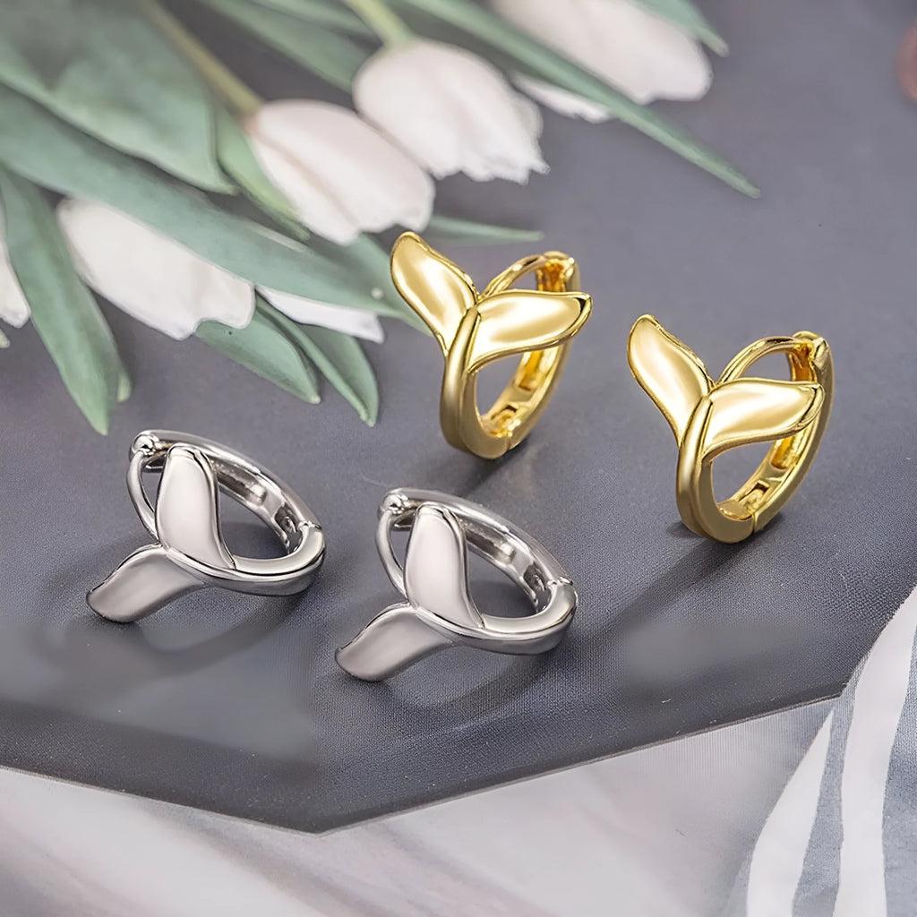 A pair of women's simple fishtail design earrings in an electroplated gold colour.