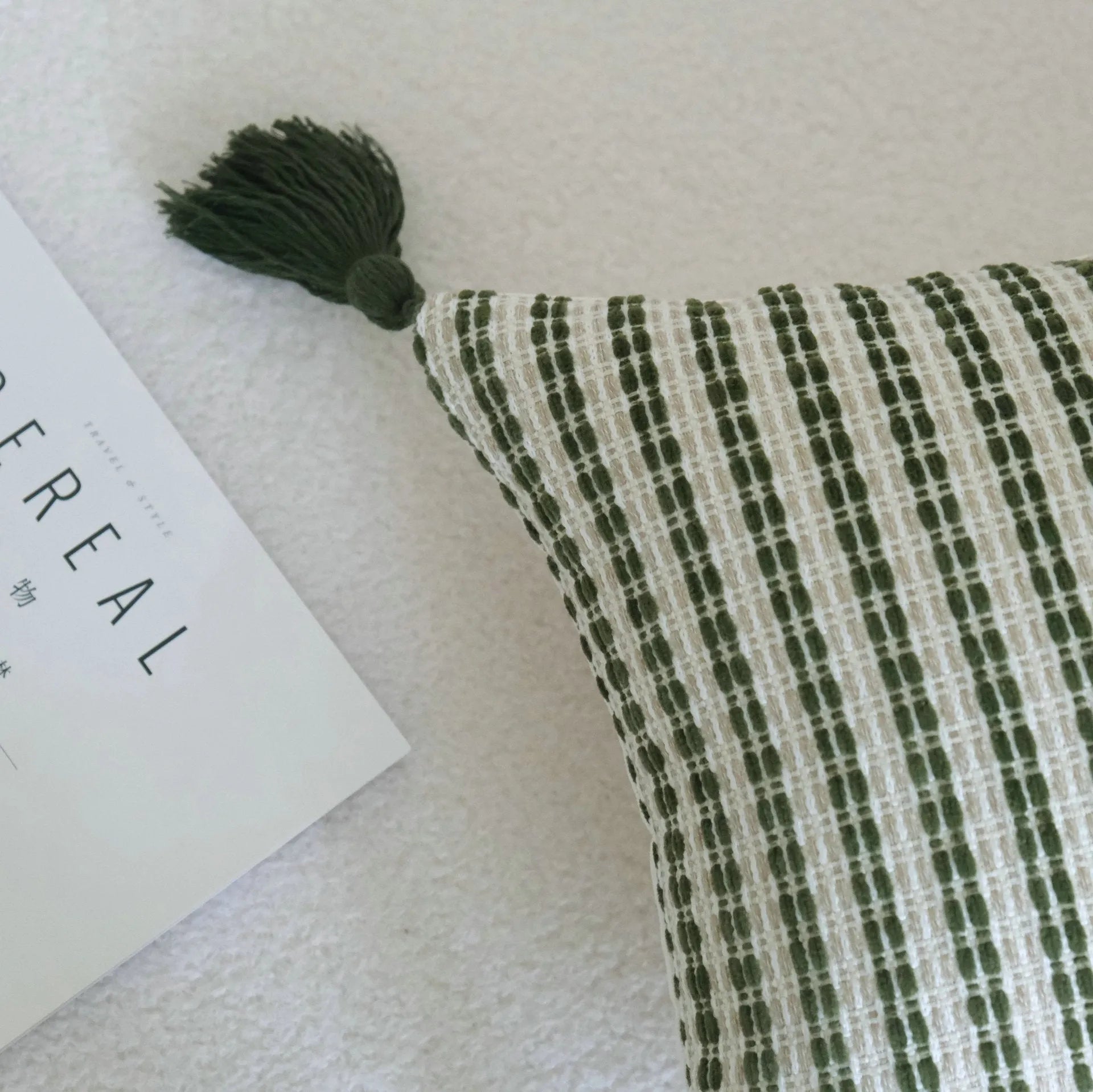 Green cotton and linen tassel hotel sample pillow with botanical pattern on brushed fabric pillowcase