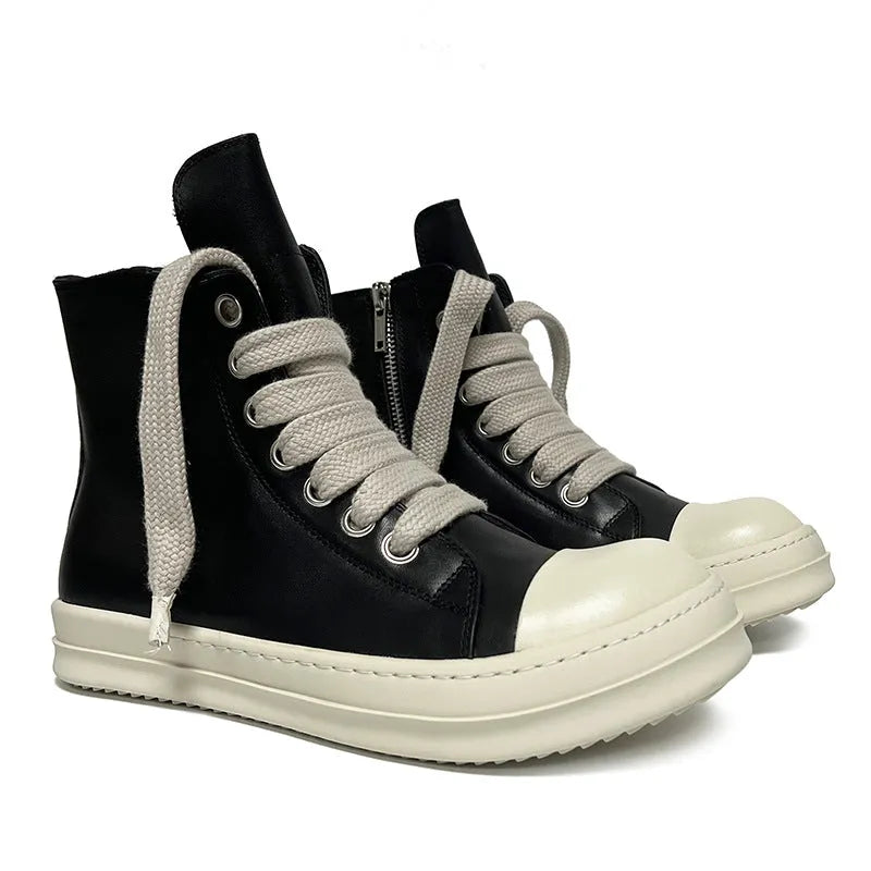 Black high-top leather sneakers with side zipper on a white background.