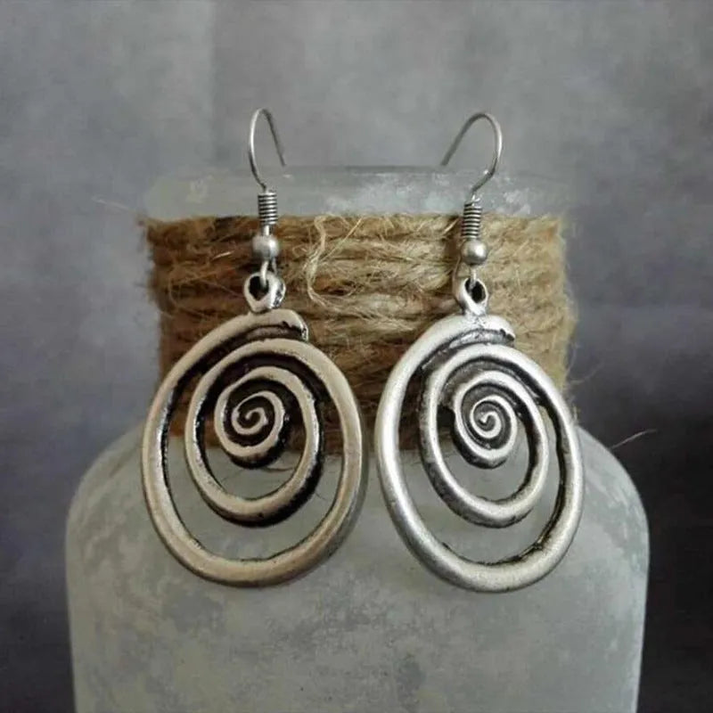 Geometric spiral earrings with distressed silver finish and retro design