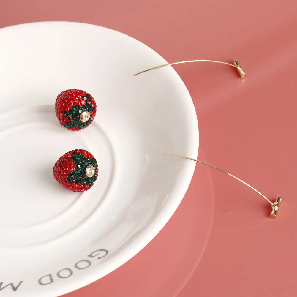 Geometric strawberry-shaped zinc alloy earrings with spot drill texture in red colour.