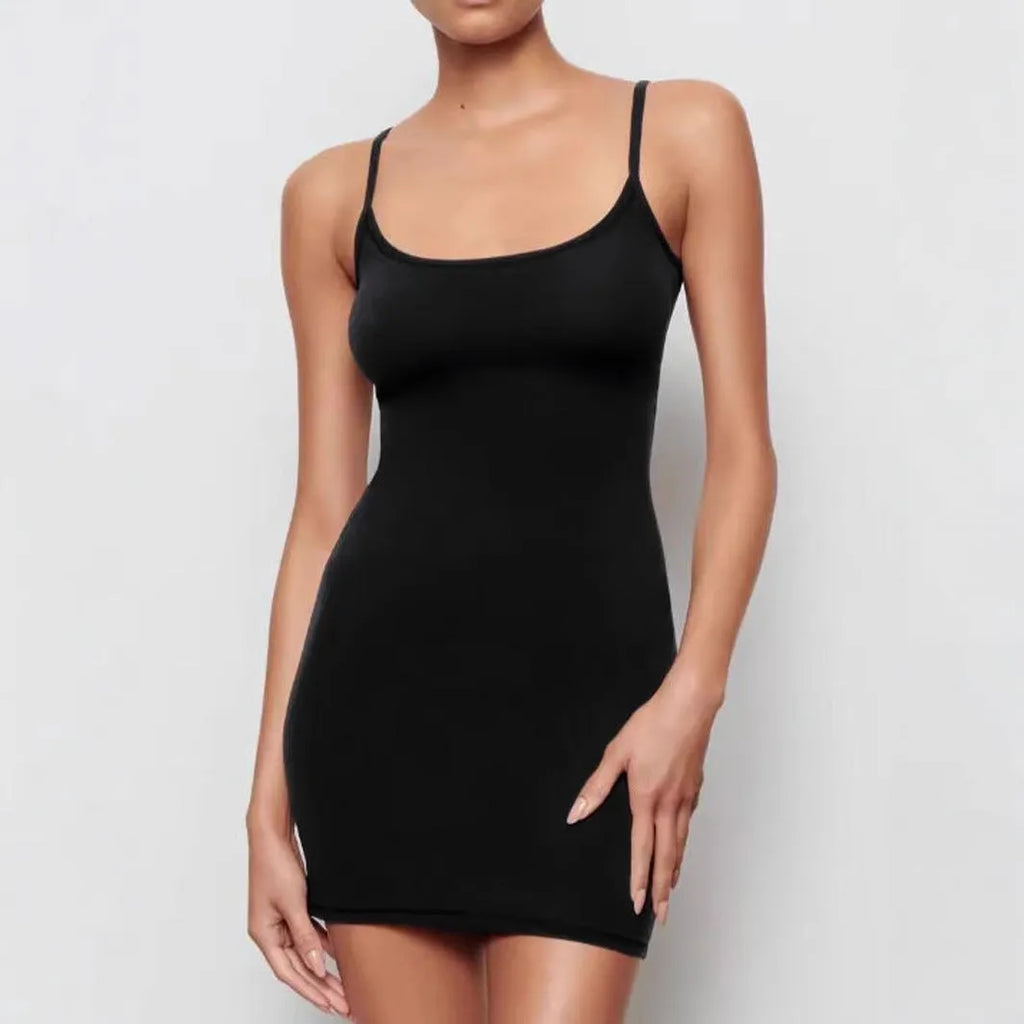 Black sleeveless sling dress with a short skirt and fitted sheath silhouette