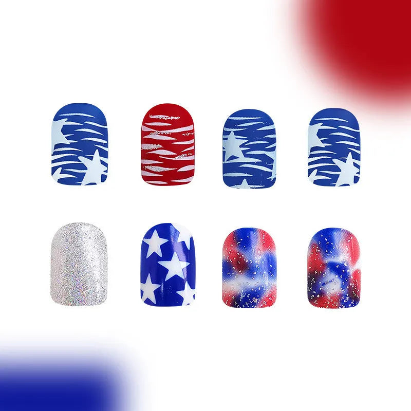 Box of short European square artificial nails with red and blue glitter decoration.