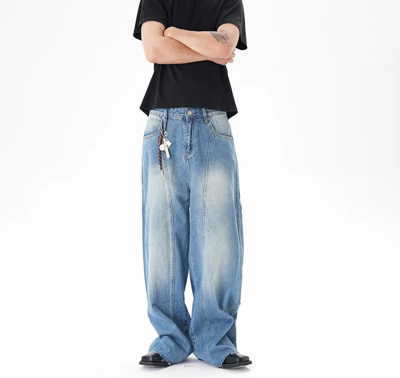 Light blue washed vintage women's wide leg jeans with a machete cut design on a front zip fly.