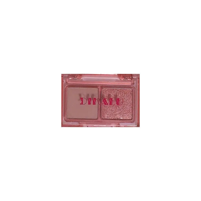 Cool two-tone eyeshadow palette open showing pink and black matte and shimmer shades for punk makeup.