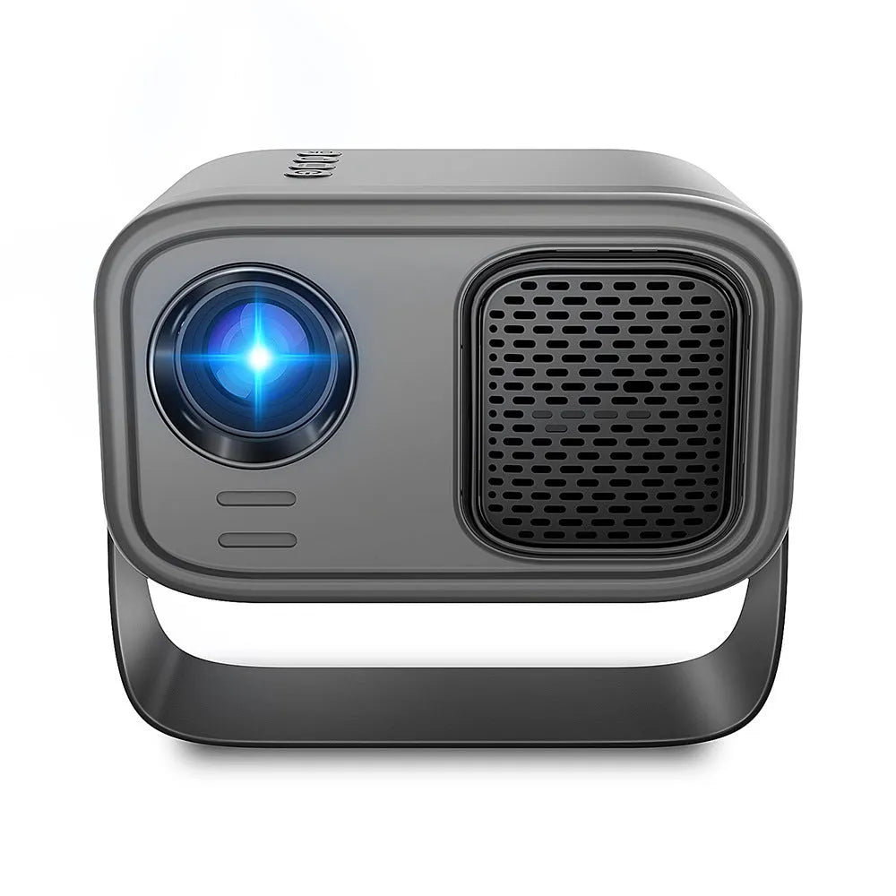 Black HD portable projector with Android system, remote control, and cables on desk