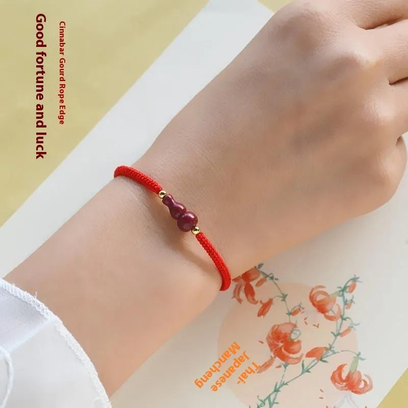 Cinnabar safety buckle bracelet with heart-shaped pendant on adjustable rope cord