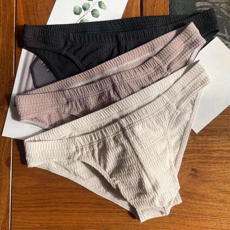 Men's solid colour cotton triangle underwear briefs in mid-waist design on a white background