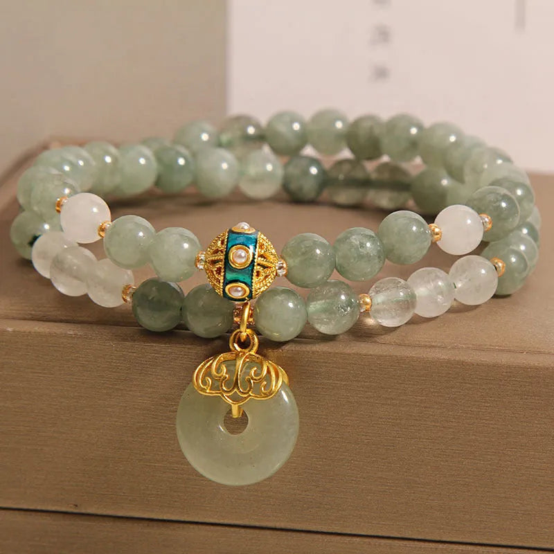 Women's double-layer crystal bracelet with peace buckle in oil emerald colour and rhinestone detailing
