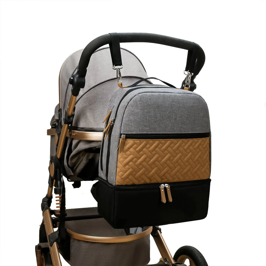 Grey insulated Oxford cloth mother and child travel backpack with curved shoulder straps, shown open to display organisation compartments.