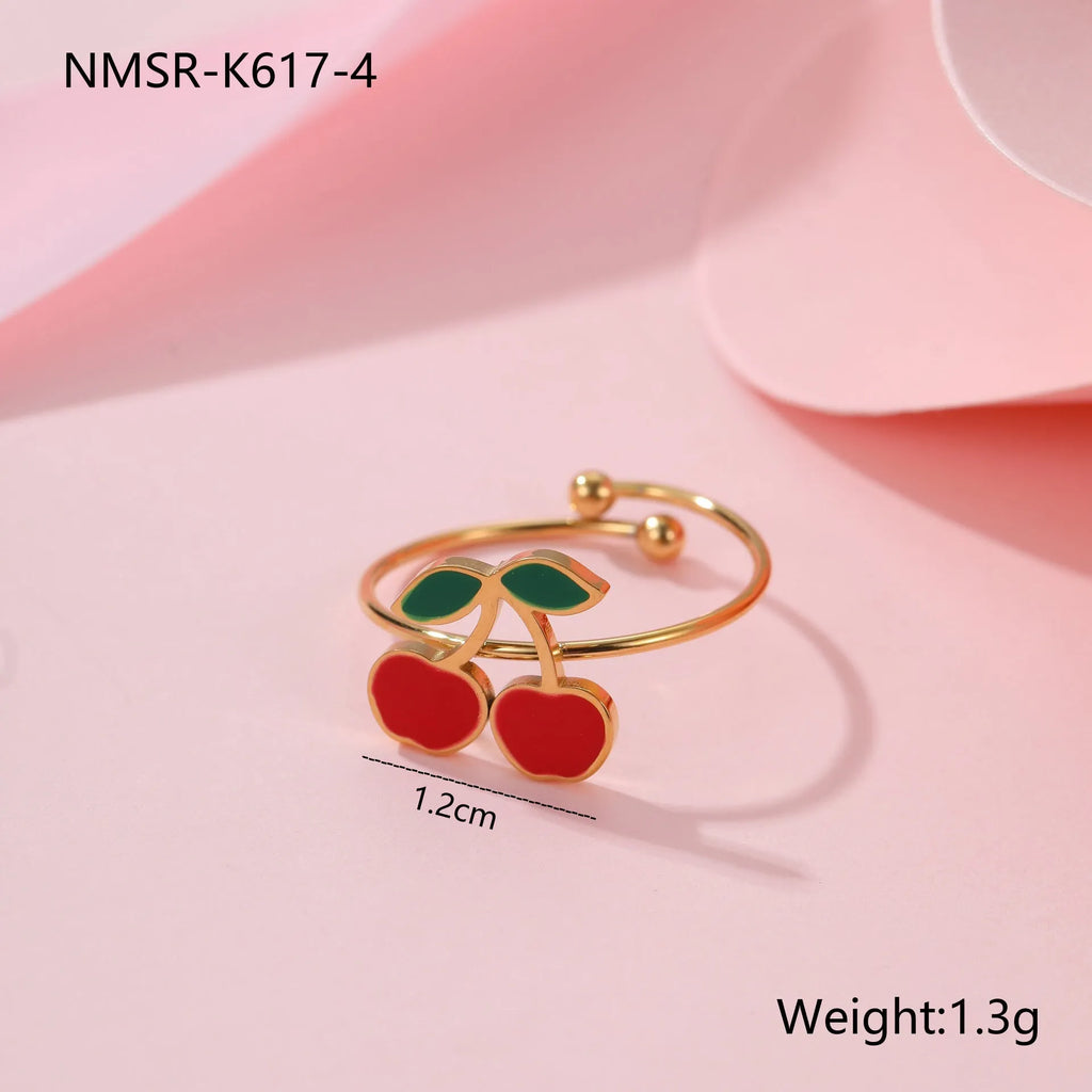 Cherry jewellery set with stainless steel necklace, bracelet, earrings, and ring featuring geometric shapes and 18K plating