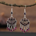 Pair of long purple drop earrings with a cascading fringe design and retro ethnic style.