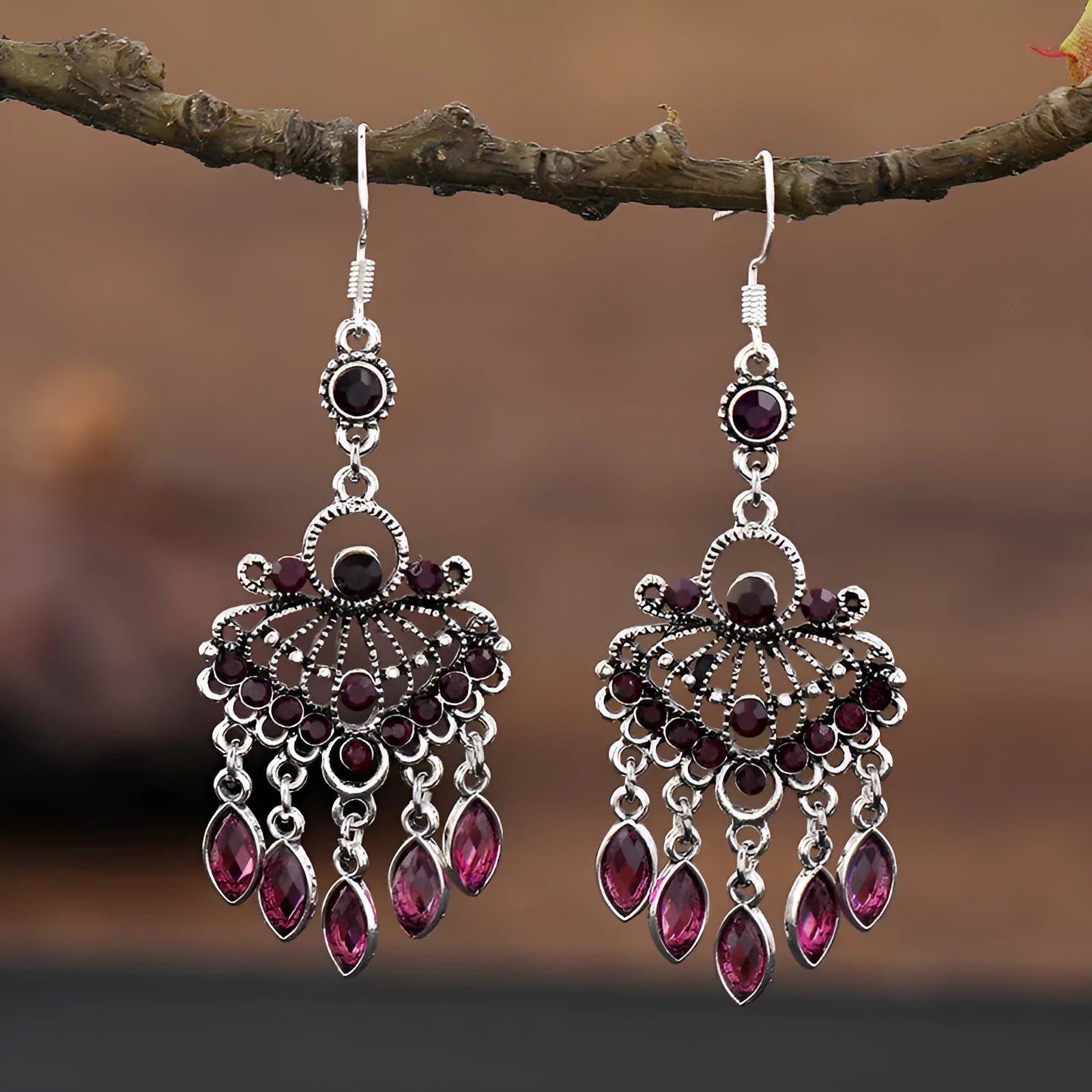 Pair of long purple drop earrings with a cascading fringe design and retro ethnic style.