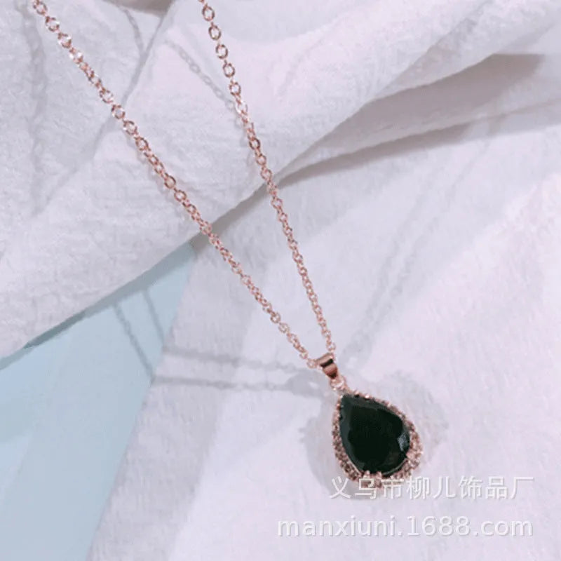 Rose gold pink drop shape women's necklace with geometric rhinestone detailing and alloy construction